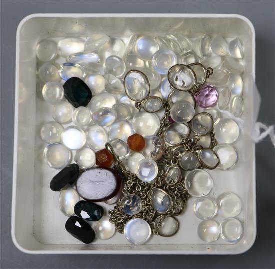 A group of mainly unmounted moonstone and other semi-precious stones.